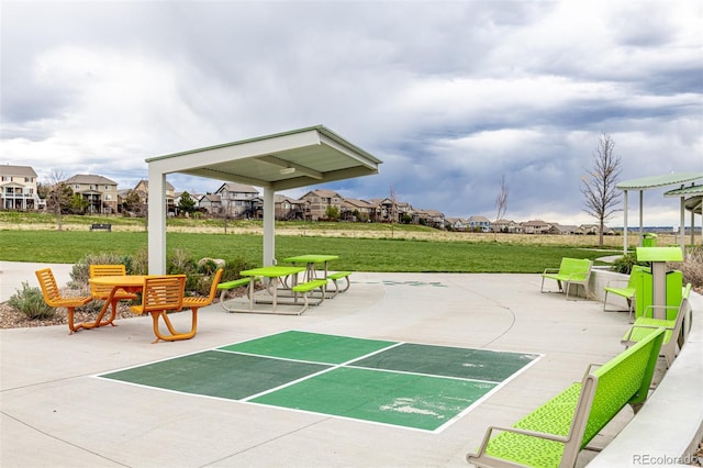 view of community featuring a yard and a residential view