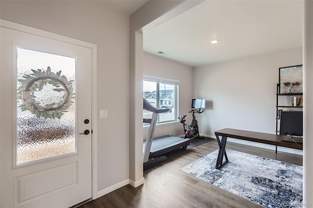 interior space with visible vents, baseboards, and dark wood-style flooring