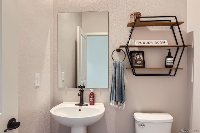 bathroom featuring a sink and toilet