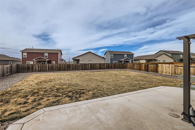 view of yard featuring a patio area and a fenced backyard