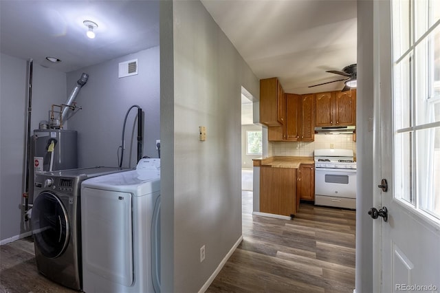 1099 Wheeling St, Aurora, CO 80011 - washroom featuring separate washer and dryer, electric water heater, a ceiling fan, and dark wood finished floors