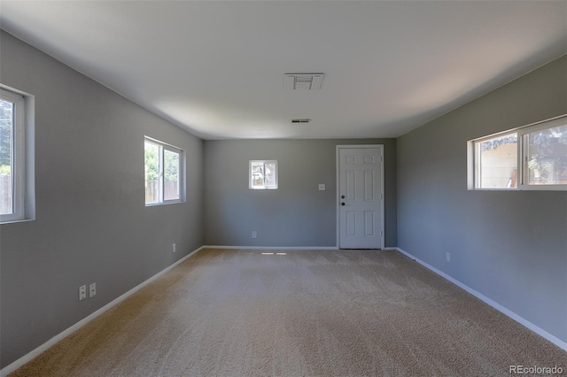 1099 Wheeling St, Aurora, CO 80011 - unfurnished room with baseboards and light colored carpet