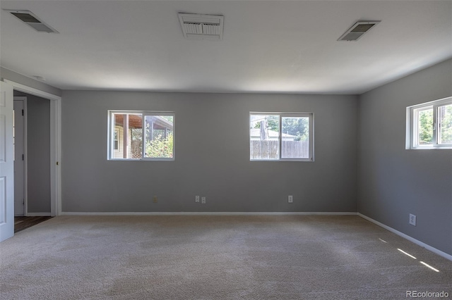 1099 Wheeling St, Aurora, CO 80011 - carpeted empty room with baseboards