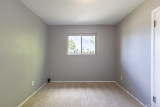 1099 Wheeling St, Aurora, CO 80011 - carpeted empty room with baseboards