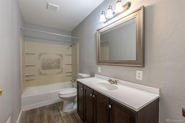 1099 Wheeling St, Aurora, CO 80011 - full bath with wood finished floors, vanity, and  shower combination