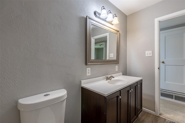 1099 Wheeling St, Aurora, CO 80011 - half bath with vanity and wood finished floors
