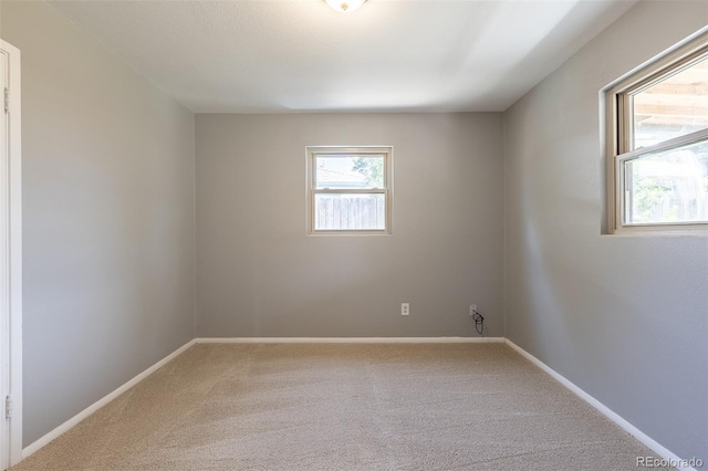 1099 Wheeling St, Aurora, CO 80011 - carpeted spare room with baseboards