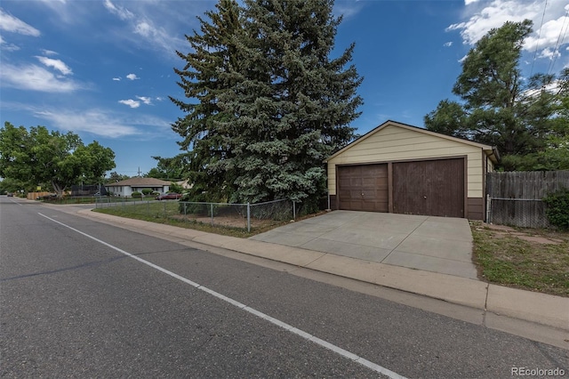 1099 Wheeling St, Aurora, CO 80011 - view of front of property featuring a garage and an outbuilding