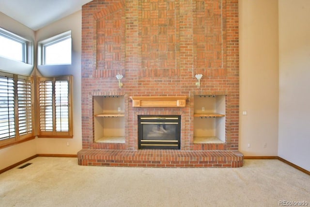 unfurnished living room with high vaulted ceiling, carpet floors, and a fireplace