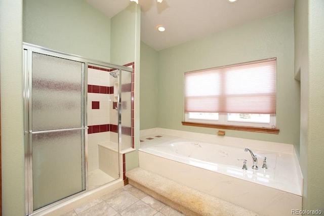 bathroom featuring tile patterned floors and separate shower and tub