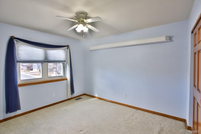 carpeted empty room with ceiling fan