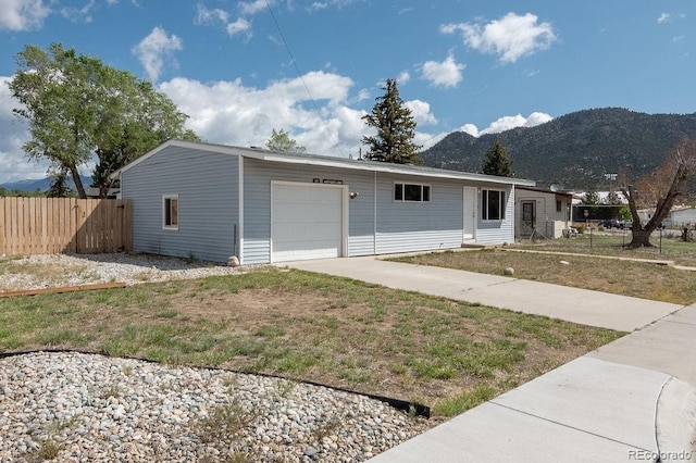 101 Harvard Ln, Buena Vista, CO 81211 - view of front facade featuring a mountain view, an attached garage, and driveway