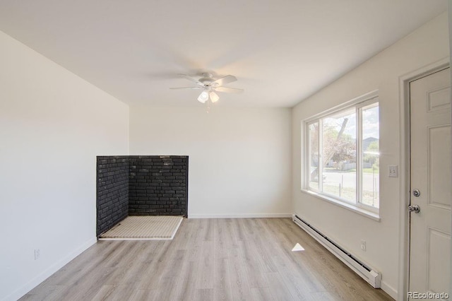 101 Harvard Ln, Buena Vista, CO 81211 - spare room featuring a baseboard radiator, light wood-style floors, a ceiling fan, and baseboards