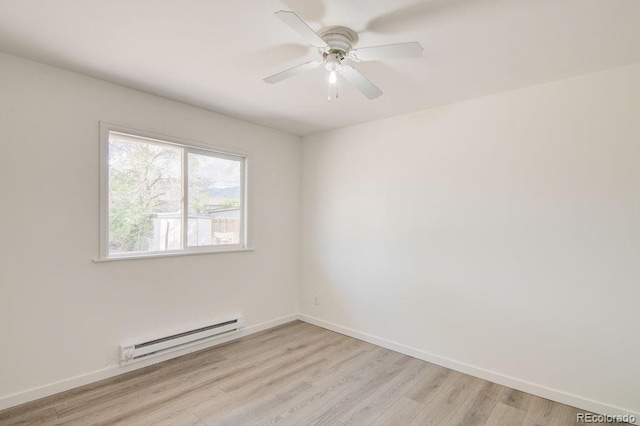 101 Harvard Ln, Buena Vista, CO 81211 - empty room with a baseboard heating unit, light wood-type flooring, and baseboards