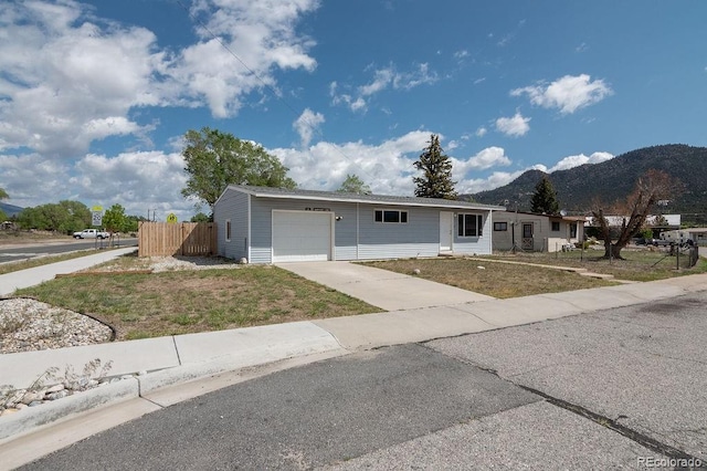 101 Harvard Ln, Buena Vista, CO 81211 - ranch-style house with a mountain view, a garage, and driveway