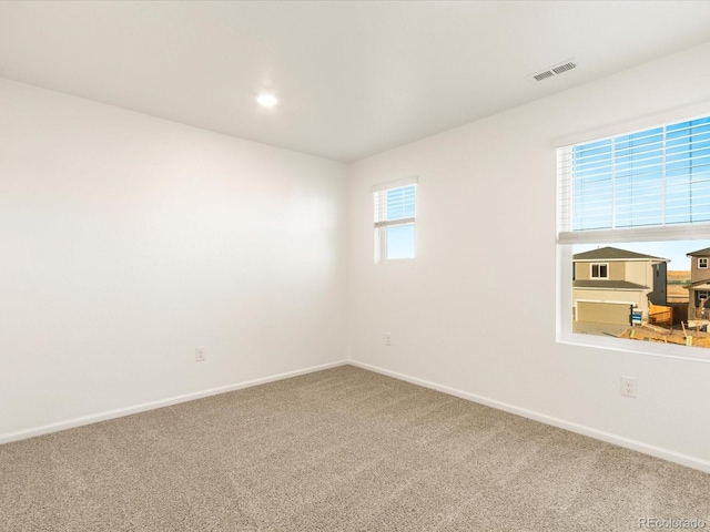 empty room with carpet flooring