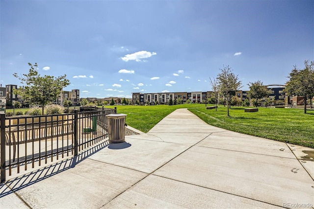 view of property's community featuring a lawn