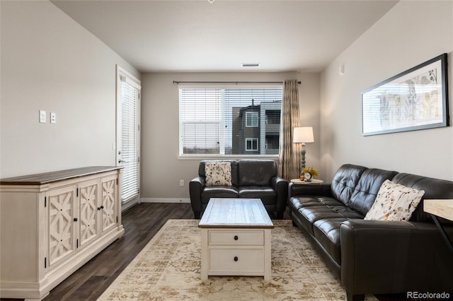 living room featuring dark hardwood / wood-style floors