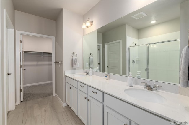 bathroom featuring vanity and walk in shower