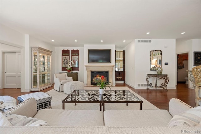 344 Saint Paul St, Denver, CO 80206 - living room with wood finished floors, recessed lighting, a lit fireplace, and baseboards