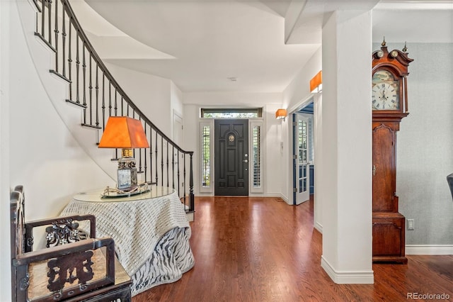 344 Saint Paul St, Denver, CO 80206 - foyer featuring stairs, wood finished floors, and baseboards