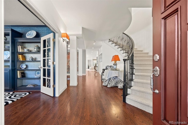 344 Saint Paul St, Denver, CO 80206 - entrance foyer featuring stairs, wood finished floors, and baseboards