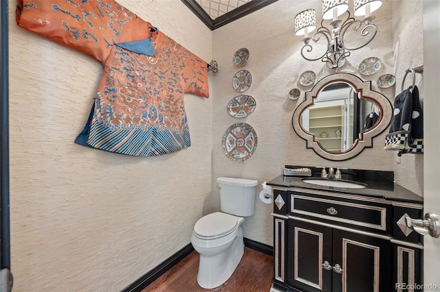 344 Saint Paul St, Denver, CO 80206 - half bathroom with wood finished floors, vanity, toilet, a chandelier, and baseboards