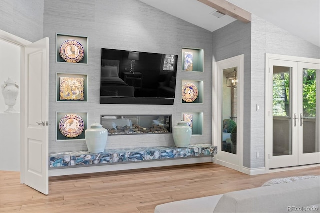 344 Saint Paul St, Denver, CO 80206 - living area featuring vaulted ceiling, wood finished floors, french doors, and baseboards