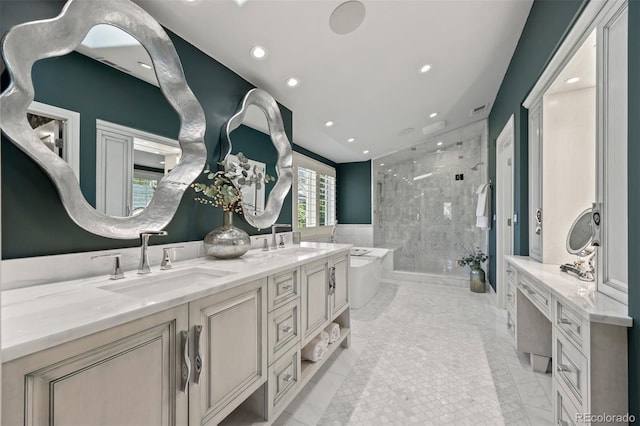 344 Saint Paul St, Denver, CO 80206 - bathroom with a marble finish shower, marble look tile flooring, a freestanding tub, double vanity, and recessed lighting