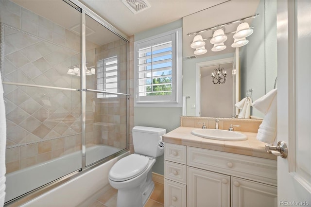 344 Saint Paul St, Denver, CO 80206 - bathroom featuring toilet, vanity, combined bath / shower with glass door, and a chandelier