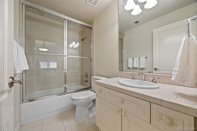344 Saint Paul St, Denver, CO 80206 - bathroom featuring vanity, bath / shower combo with glass door, toilet, tile patterned flooring, and a chandelier