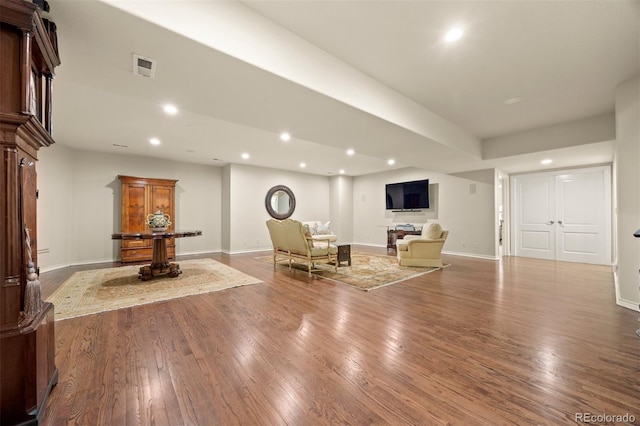 344 Saint Paul St, Denver, CO 80206 - living area featuring recessed lighting, baseboards, and wood finished floors