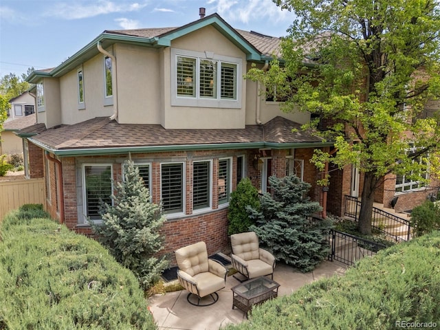 344 Saint Paul St, Denver, CO 80206 - rear view of house with stucco siding and brick siding