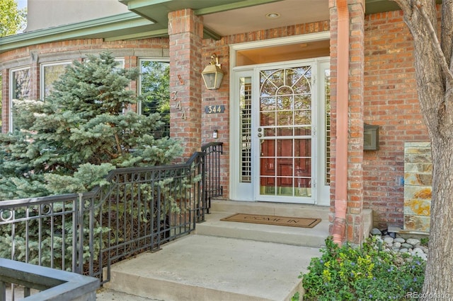 344 Saint Paul St, Denver, CO 80206 - view of exterior entry featuring brick siding and covered porch