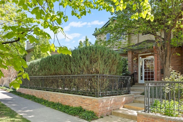344 Saint Paul St, Denver, CO 80206 - doorway to property featuring brick siding