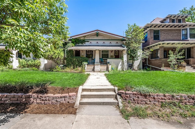 view of front facade with a porch and a front lawn