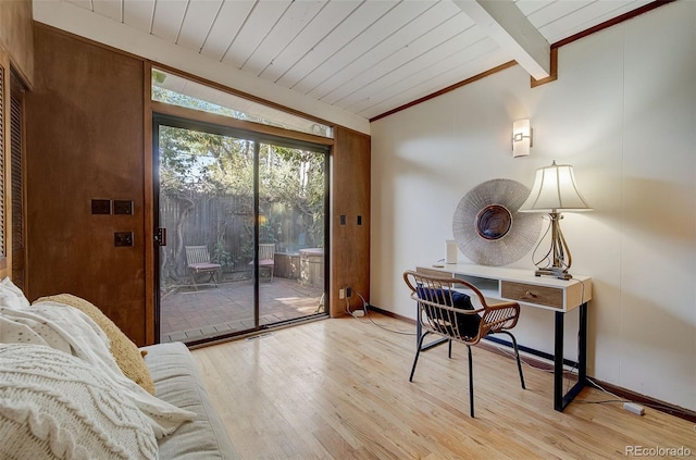 home office featuring light hardwood / wood-style flooring, lofted ceiling with beams, ornamental molding, and wooden ceiling