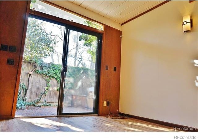 entryway featuring wood ceiling, lofted ceiling, and light hardwood / wood-style floors