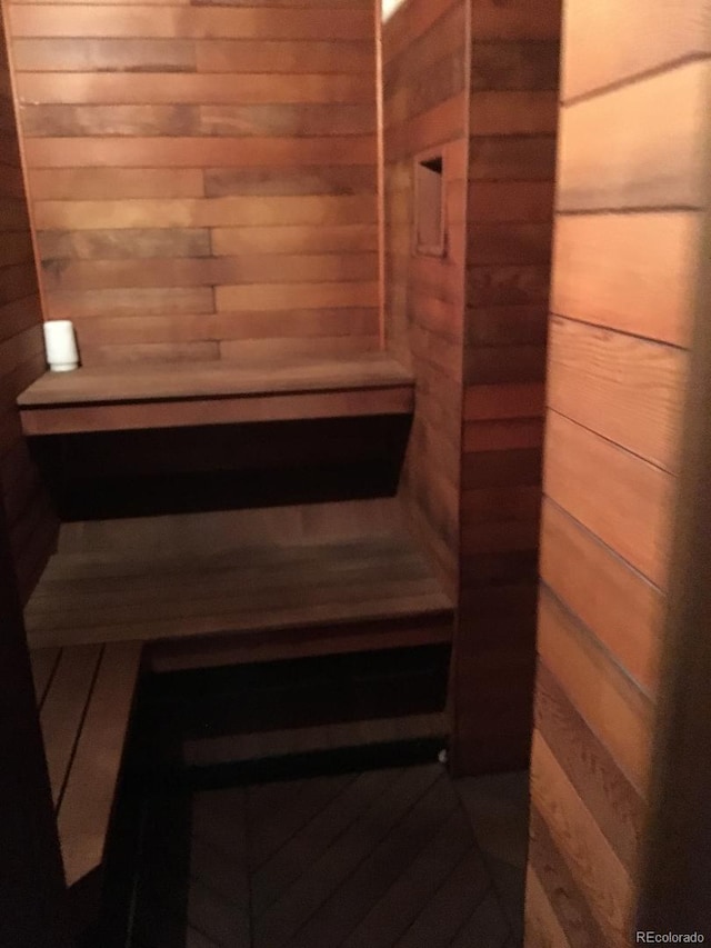 view of sauna / steam room with wooden walls