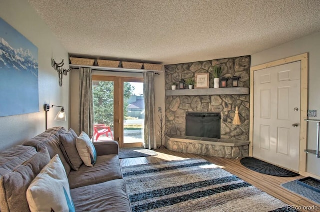 170 Gcr 838 Unit 6, Fraser, CO 80442 - living area featuring wood finished floors, a textured ceiling, and a fireplace