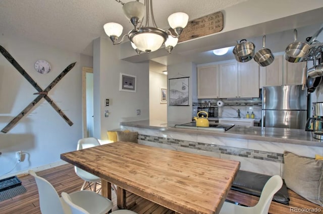 170 Gcr 838 Unit 6, Fraser, CO 80442 - dining room with wood finished floors, a textured ceiling, and baseboards