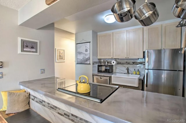 170 Gcr 838 Unit 6, Fraser, CO 80442 - kitchen with black appliances, a sink, and tasteful backsplash