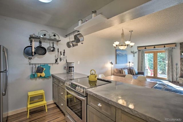 170 Gcr 838 Unit 6, Fraser, CO 80442 - kitchen featuring appliances with stainless steel finishes, wood finished floors, a chandelier, french doors, and baseboards