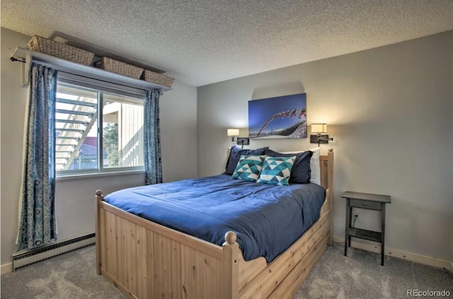 170 Gcr 838 Unit 6, Fraser, CO 80442 - bedroom featuring a baseboard heating unit, carpet floors, a textured ceiling, and baseboards