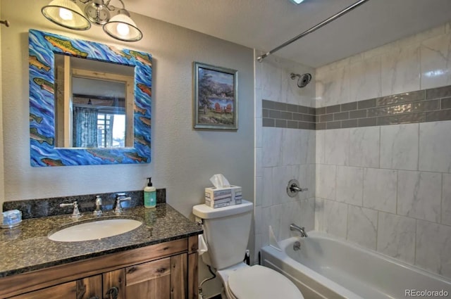 170 Gcr 838 Unit 6, Fraser, CO 80442 - bathroom with toilet,  shower combination, vanity, and a textured wall