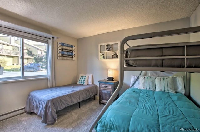 170 Gcr 838 Unit 6, Fraser, CO 80442 - bedroom featuring baseboard heating, a textured ceiling, and carpet flooring