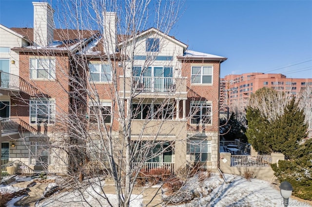 111 S Monroe St Unit B203, Denver, CO 80209 - back of house with a chimney and brick siding