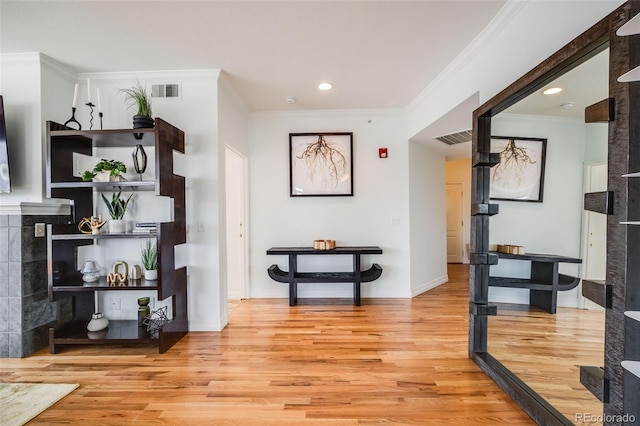 111 S Monroe St Unit B203, Denver, CO 80209 - hall with light wood finished floors, crown molding, and recessed lighting