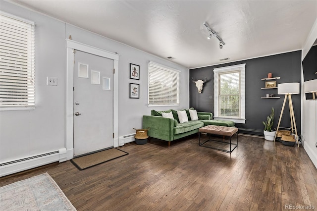 3464 S Downing St, Englewood, CO 80113 - living area with wood finished floors, a baseboard heating unit, and track lighting