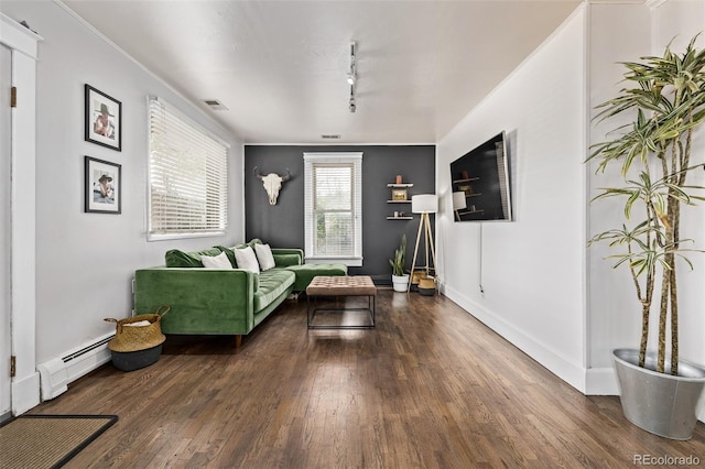 3464 S Downing St, Englewood, CO 80113 - living room with a baseboard heating unit, wood finished floors, and track lighting